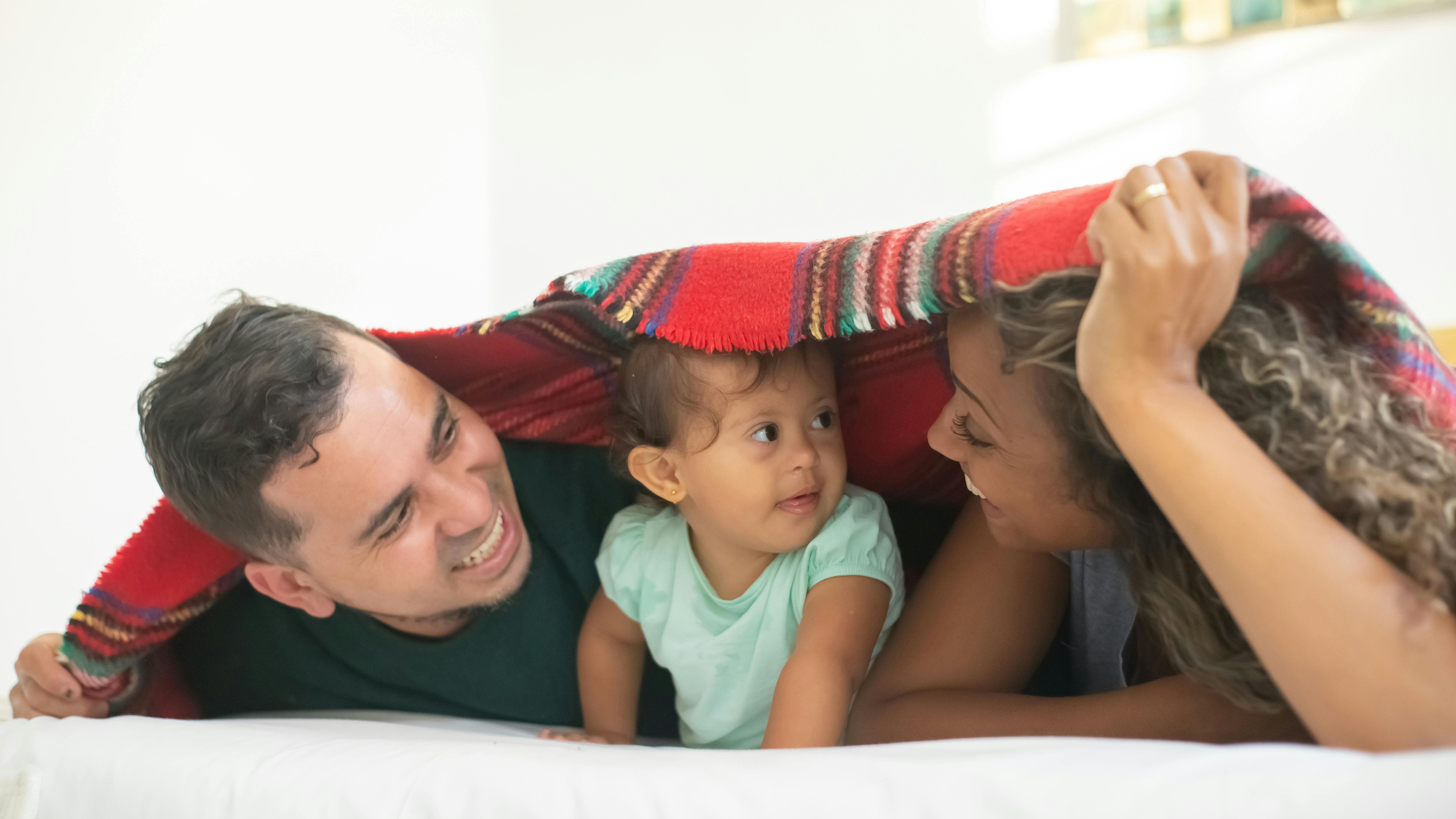 Loving Hispanic parent protecting child